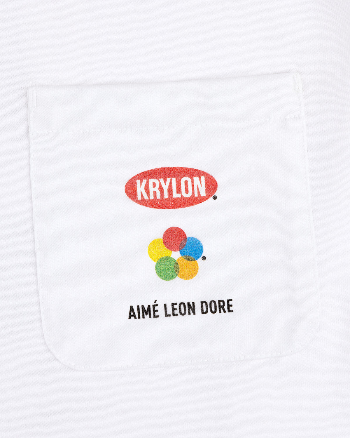 Krylon Pocket Tee: White shirt with pocket, KRYLON logo, colorful dots, and AIMÉ LEON DORE text below.