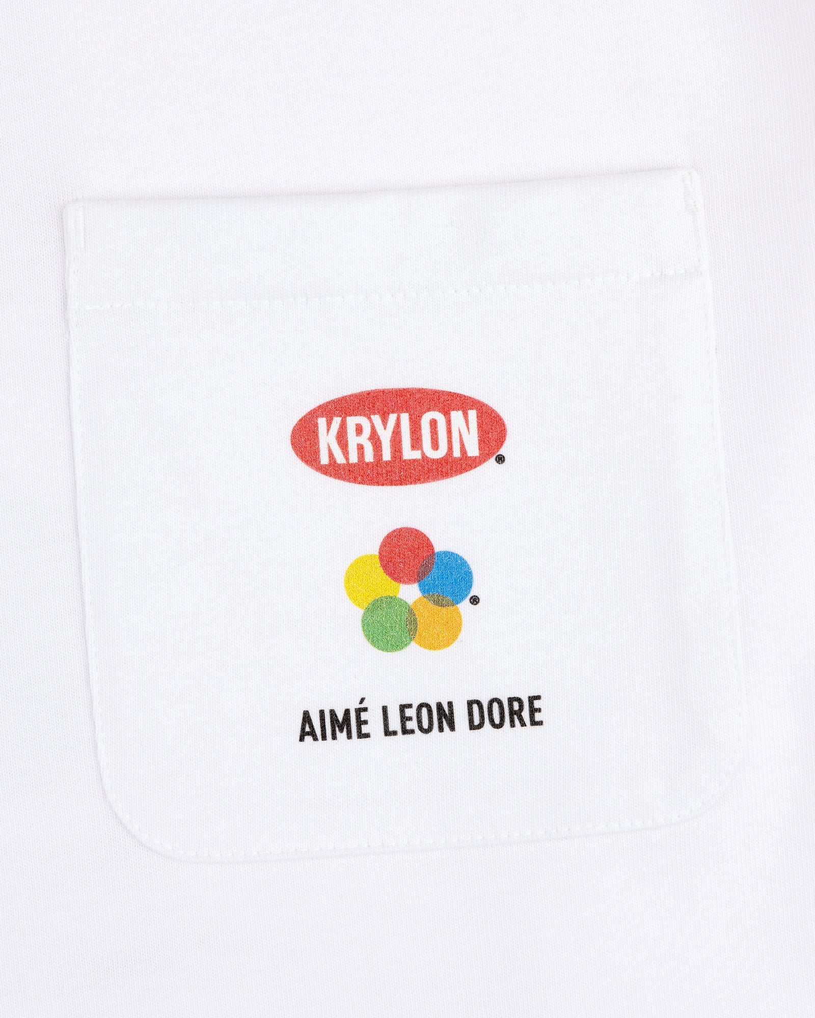 Krylon Pocket Tee: White shirt with pocket, KRYLON logo, colorful dots, and AIMÉ LEON DORE text below.