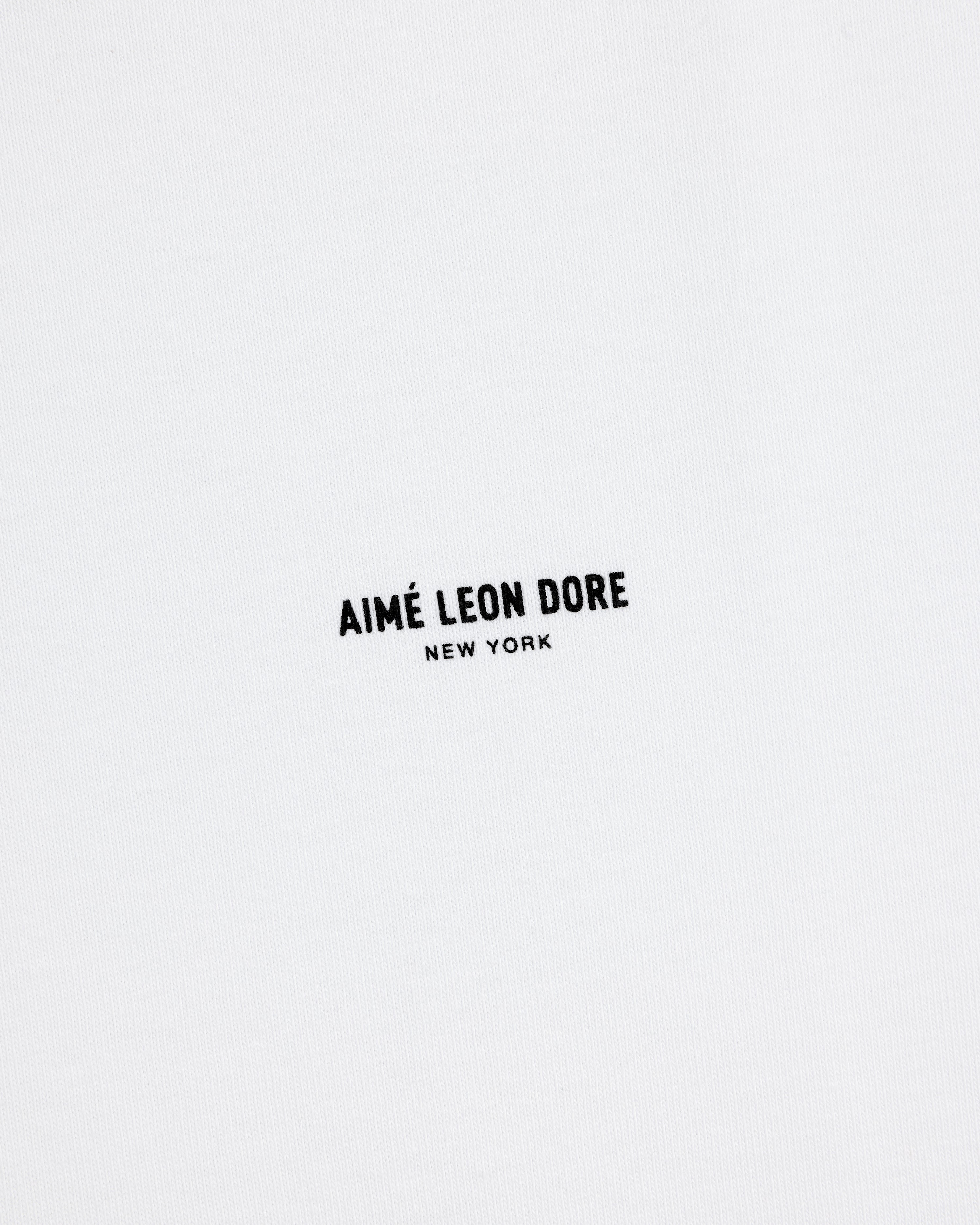 White Long-Sleeve Micro Logo Tee with small black "AIMÉ LEON DORE" text and "NEW YORK" below in the center.