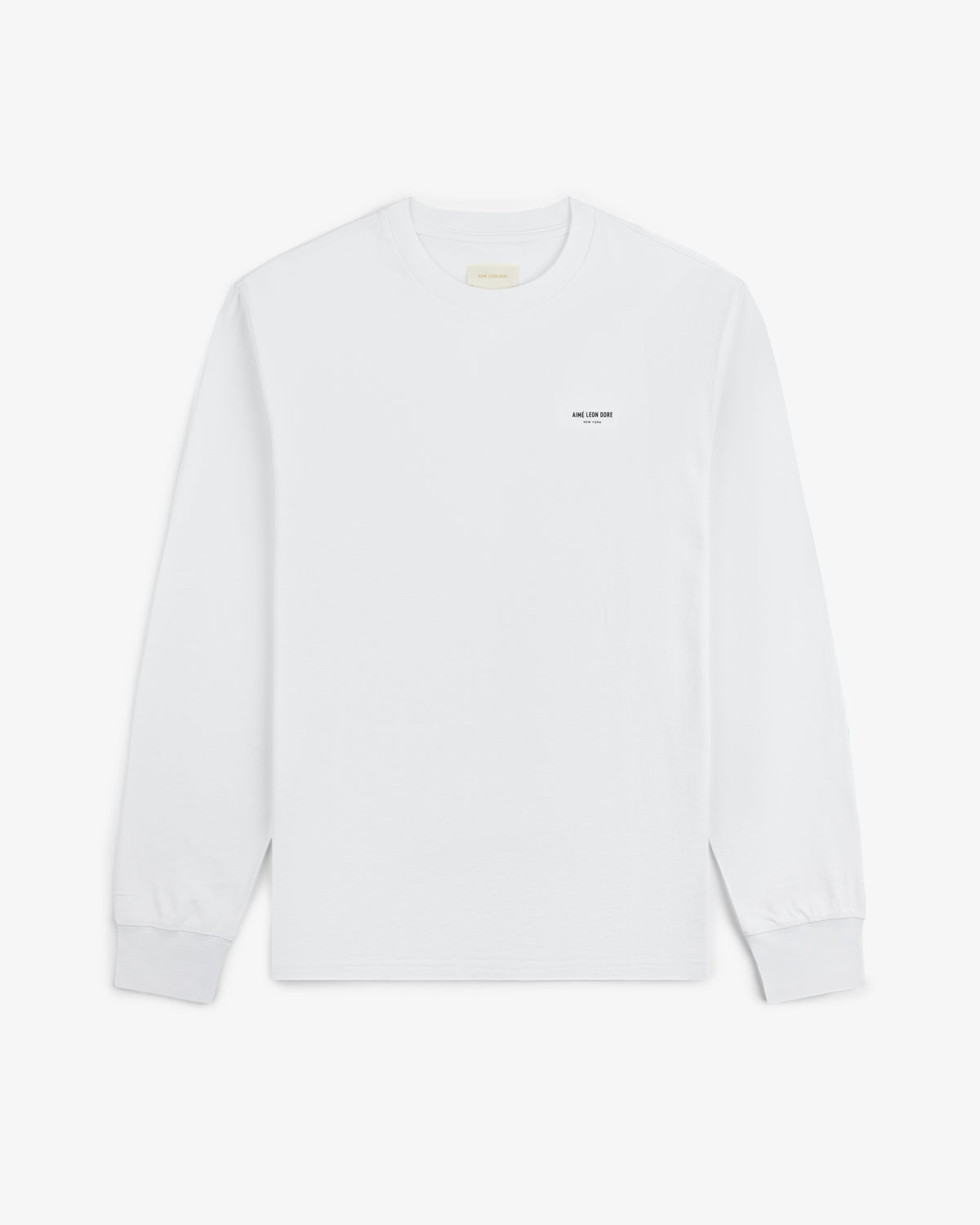 Long-Sleeve Micro Logo Tee: white crewneck with small black text on the left chest.