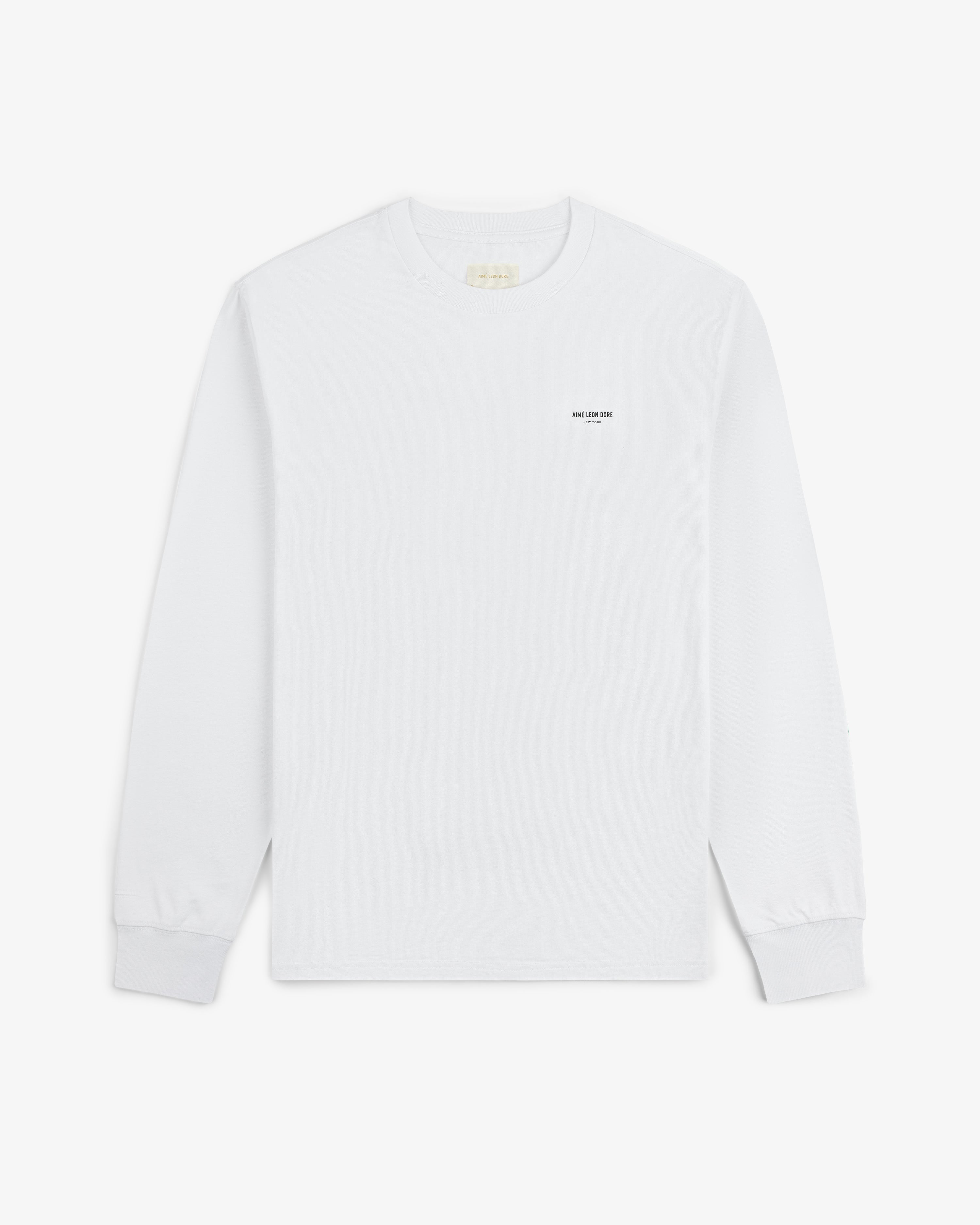 Long-Sleeve Micro Logo Tee: white crewneck with small black text on the left chest.