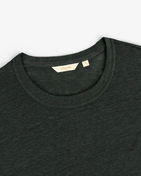 Dark green Long-Sleeve Linen Tee, size medium, crew neck, laid flat on a white surface with visible label.
