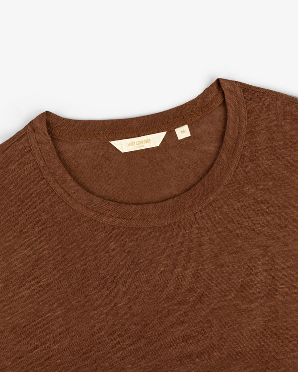 Long-Sleeve Linen Tee in brown laid flat, displaying the crew neckline, collar, and inner "M" size label.