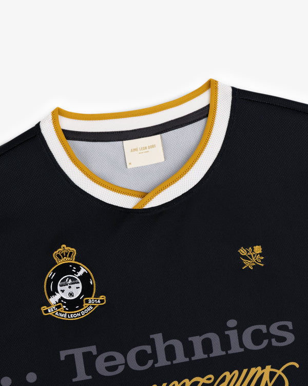 ALD / Technics Soccer Jersey: Black mesh with gold/white collar, embroidered crests, and Technics front text.