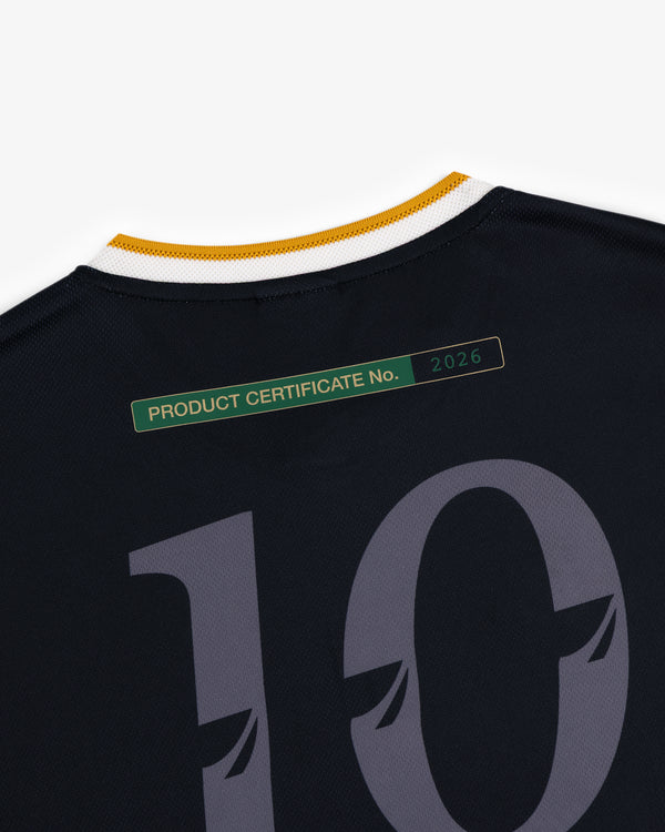 Close-up of the ALD / Technics Soccer Jersey, black with number 10 and a green Product Certificate No. 2026 near the collar.
