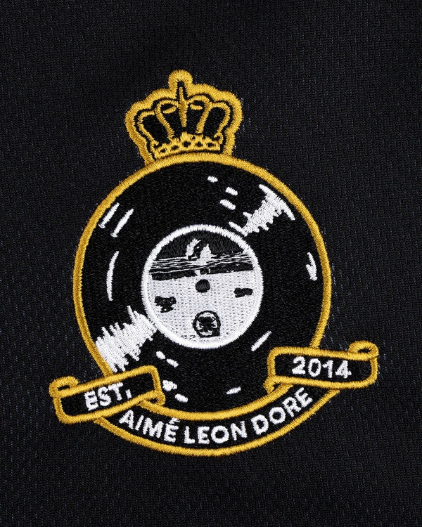 ALD / Technics Soccer Jersey features an embroidered Aimé Leon Dore crest with crown, vinyl record & EST 2014 on black.