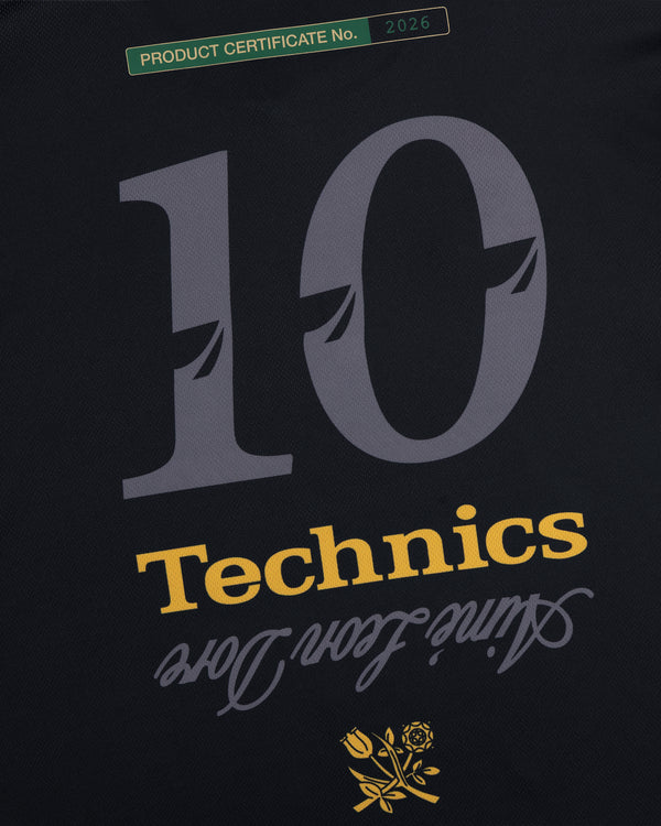 Black background ALD / Technics Soccer Jersey: big yellow "10," cursive “love,” rose, green certificate label.