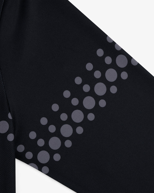 Close-up of ALD / Technics Soccer Jersey's black fabric with gray circles in diagonal rows.