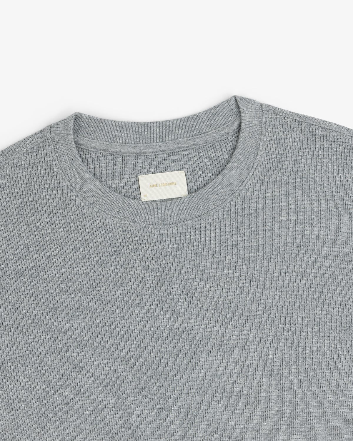 Gray Long-Sleeve Waffle Thermal with a visible off-white collar label, shown on a white background.