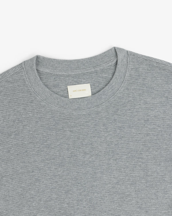 Gray Long-Sleeve Waffle Thermal with a visible off-white collar label, shown on a white background.