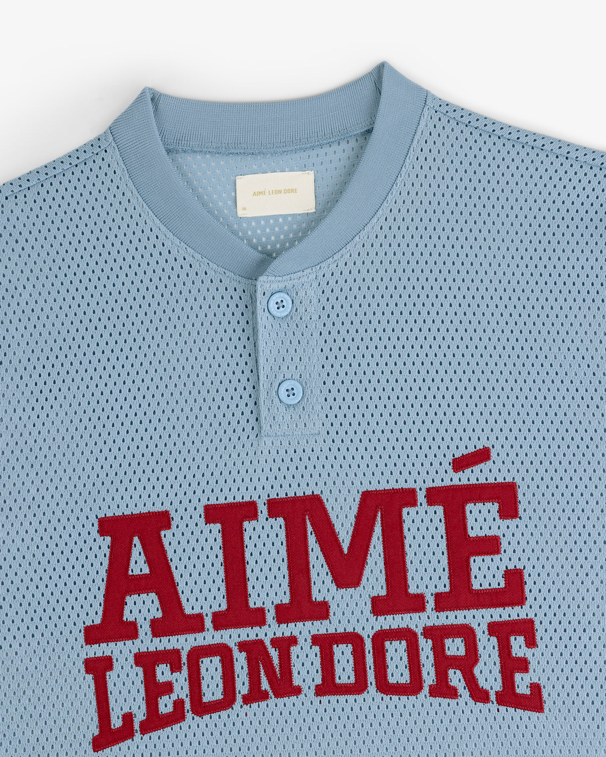 Light blue Mesh Batting Practice Jersey with AIMÉ LEON DORE in large red letters and a two-button collar.