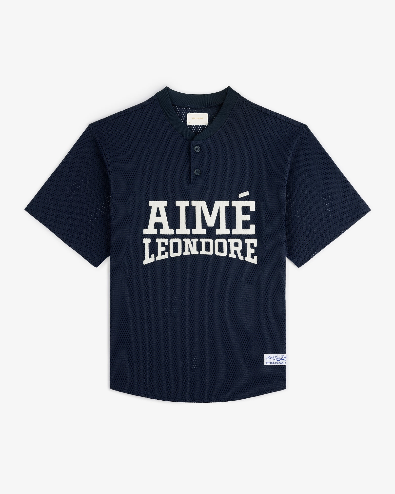 Navy blue Mesh Batting Practice Jersey with AIMÉ LEON DORE text on front and a white tag near the bottom hem.