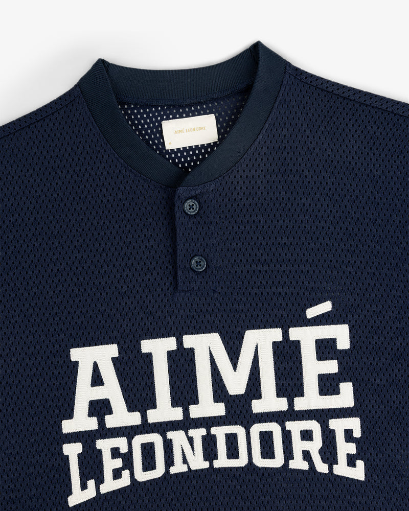 Navy Mesh Batting Practice Jersey with white AIMÉ LEON DORE text and two buttons at the collar.