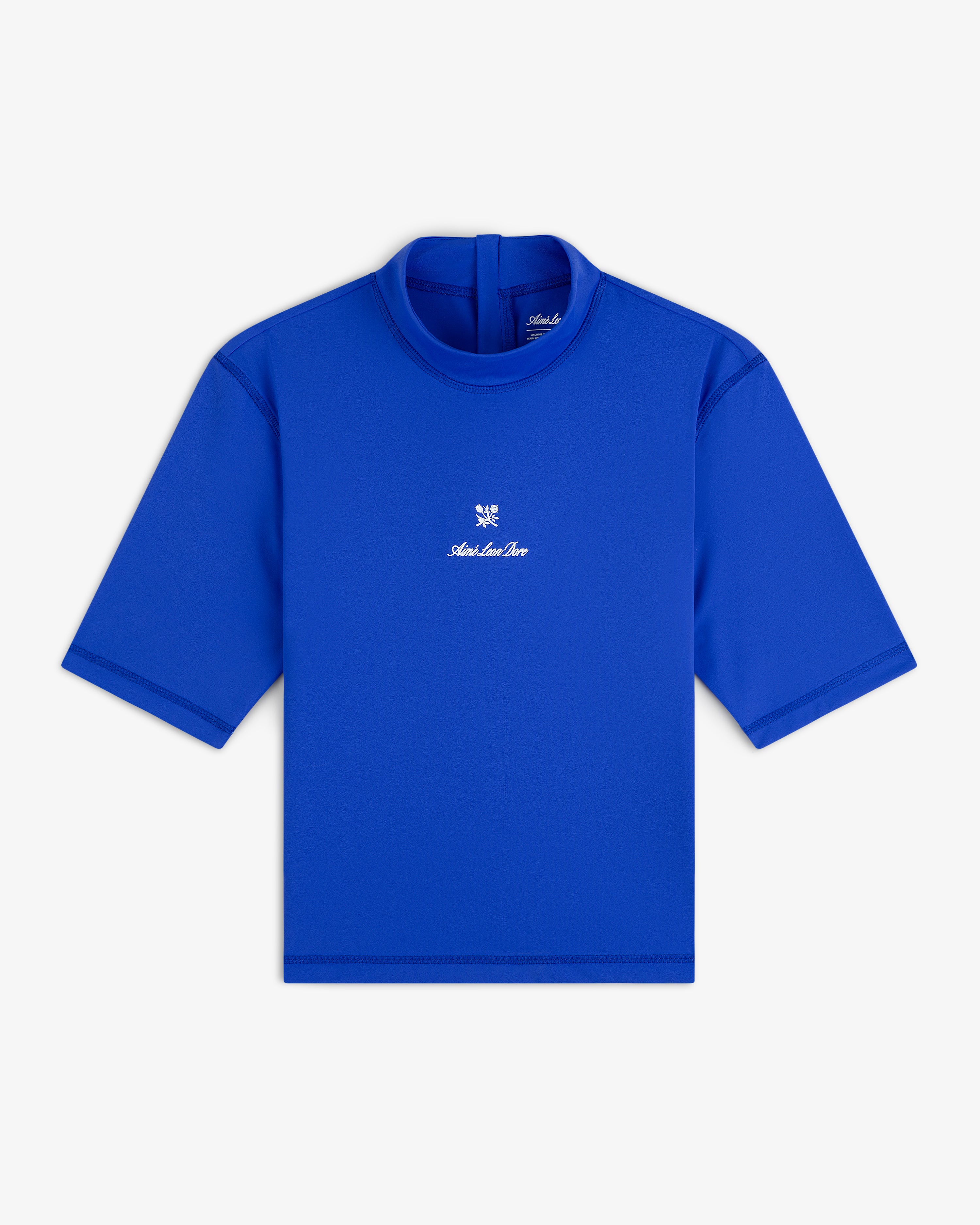 Bright blue Short Sleeve Crest Rash Guard with high neck, back zipper, and small white chest logo and text.