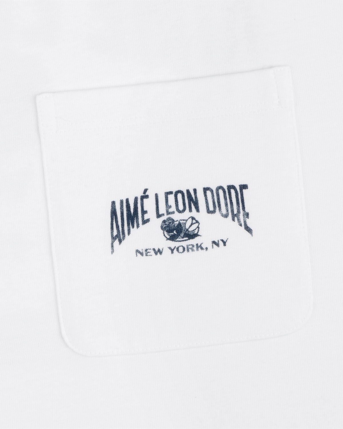 Neighborhood Pocket Tee with "Aimé Leon Dore New York, NY" and floral graphic embroidered on the white shirt pocket.