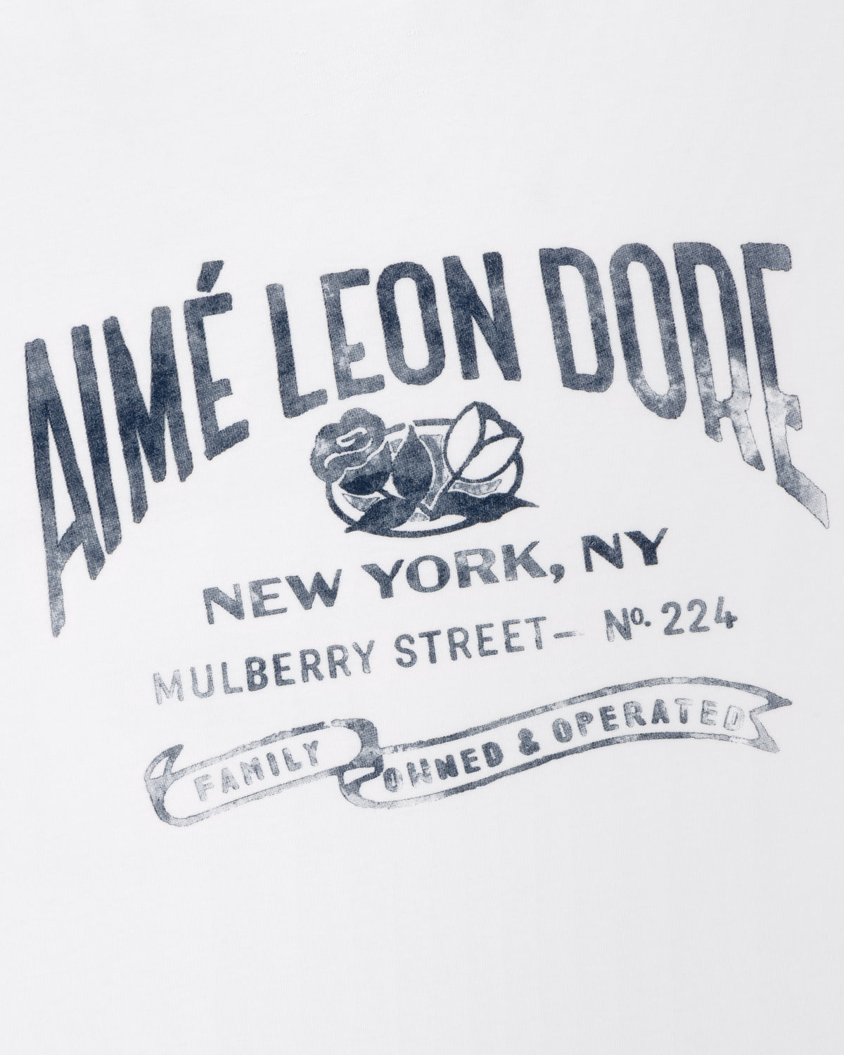 Neighborhood Pocket Tee featuring "AIMÉ LEON DORE New York, NY Mulberry St. No. 224" and rose graphic in black text.