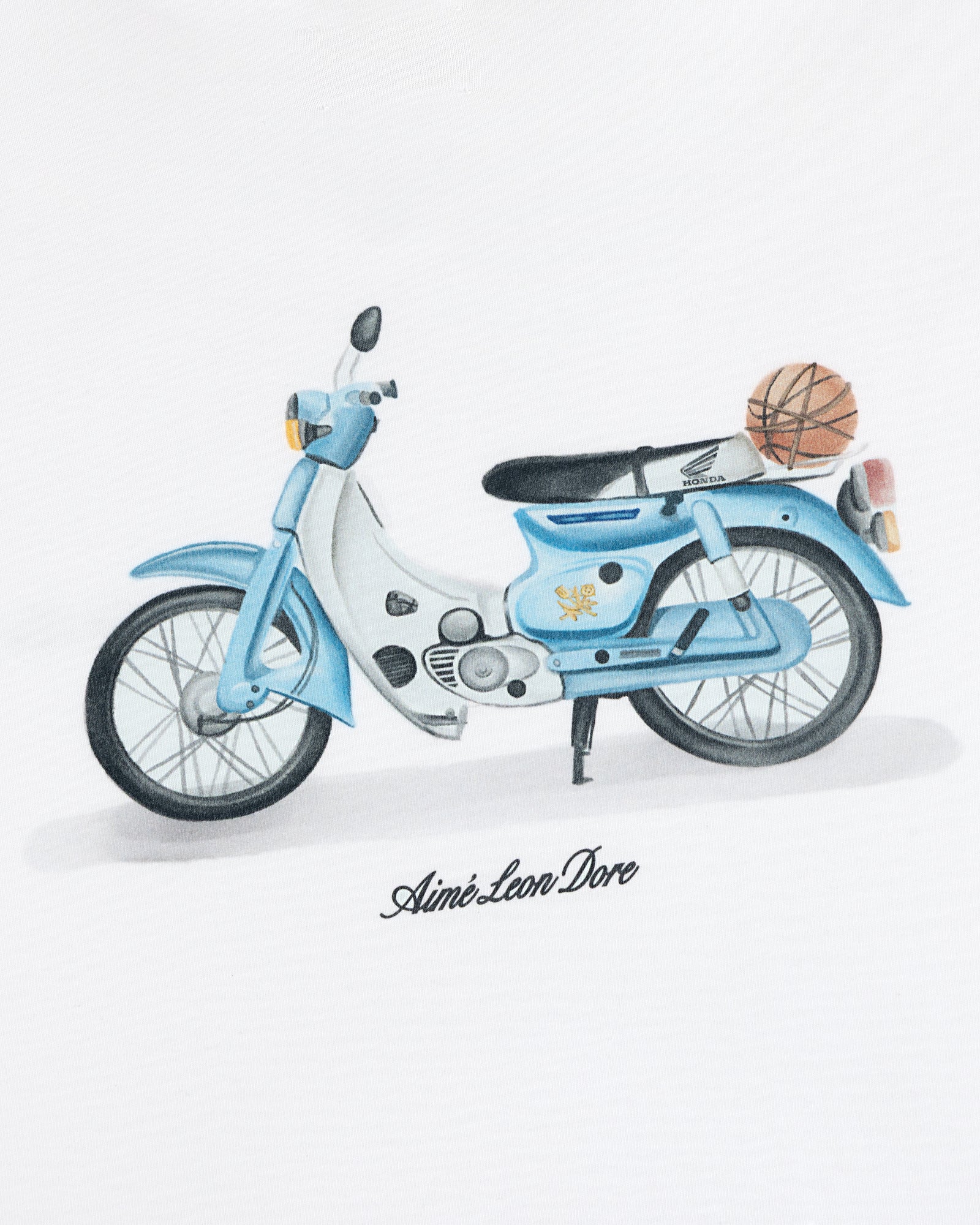A Super Cub Tee featuring a blue and white vintage moped with a basketball on the back, on a white background.