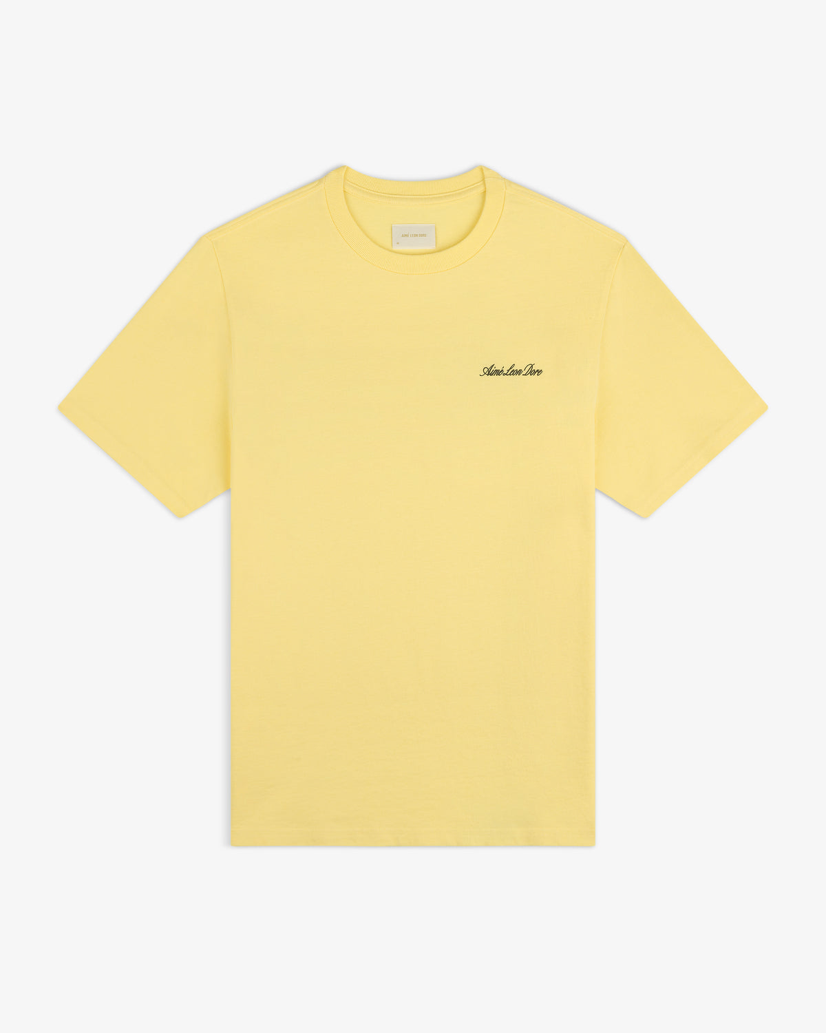 Super Cub Tee: yellow short-sleeve shirt with small black cursive text on the left chest, shown on white background.