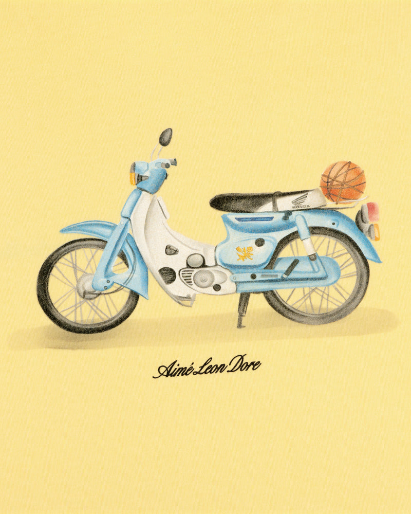 Blue and white vintage moped with a basketball on the back, above "Super Cub Tee" text.