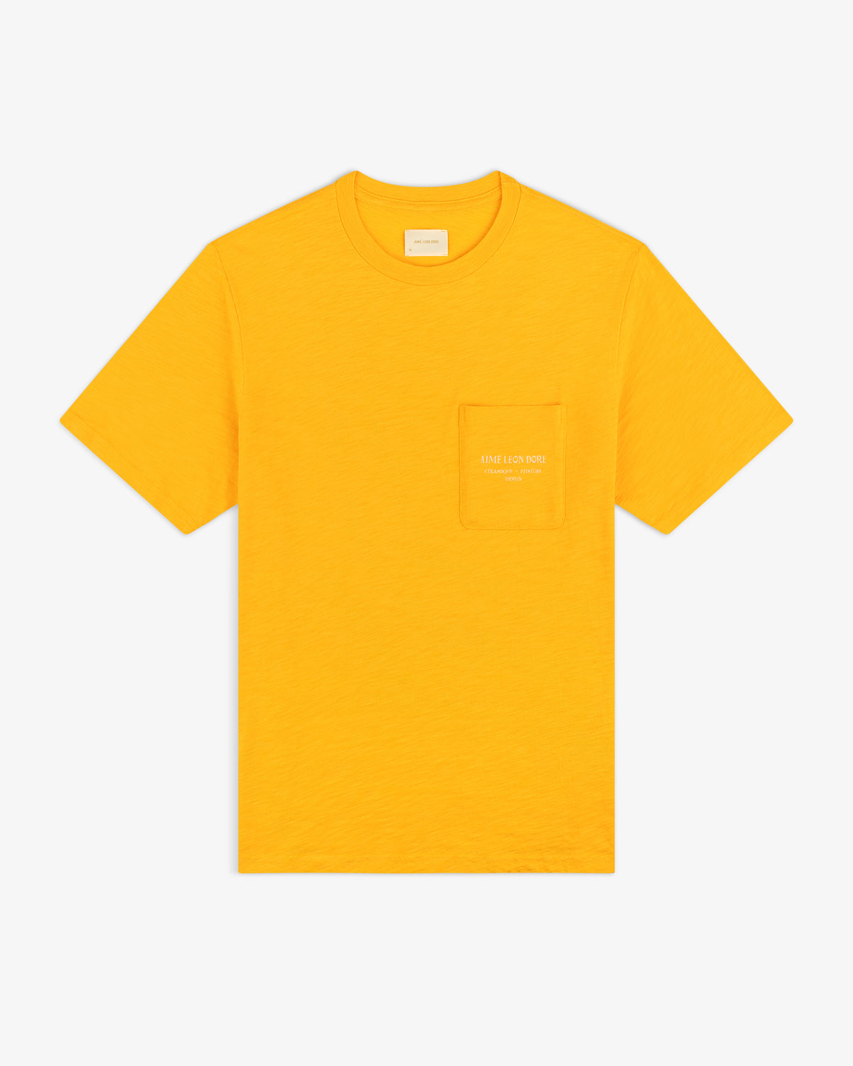 Artiste Pocket Tee: bright yellow short-sleeve t-shirt with a chest pocket featuring small white text.