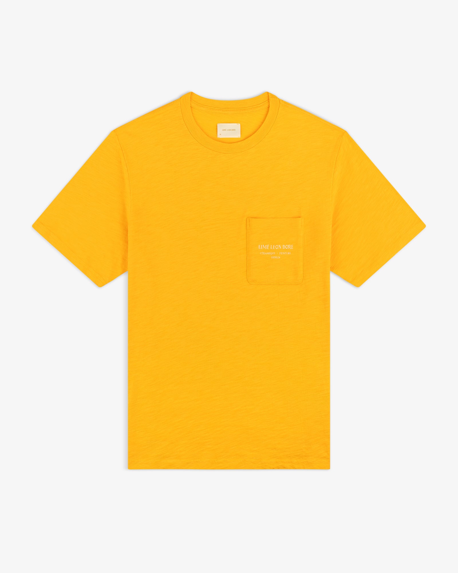 Artiste Pocket Tee: bright yellow short-sleeve t-shirt with a chest pocket featuring small white text.