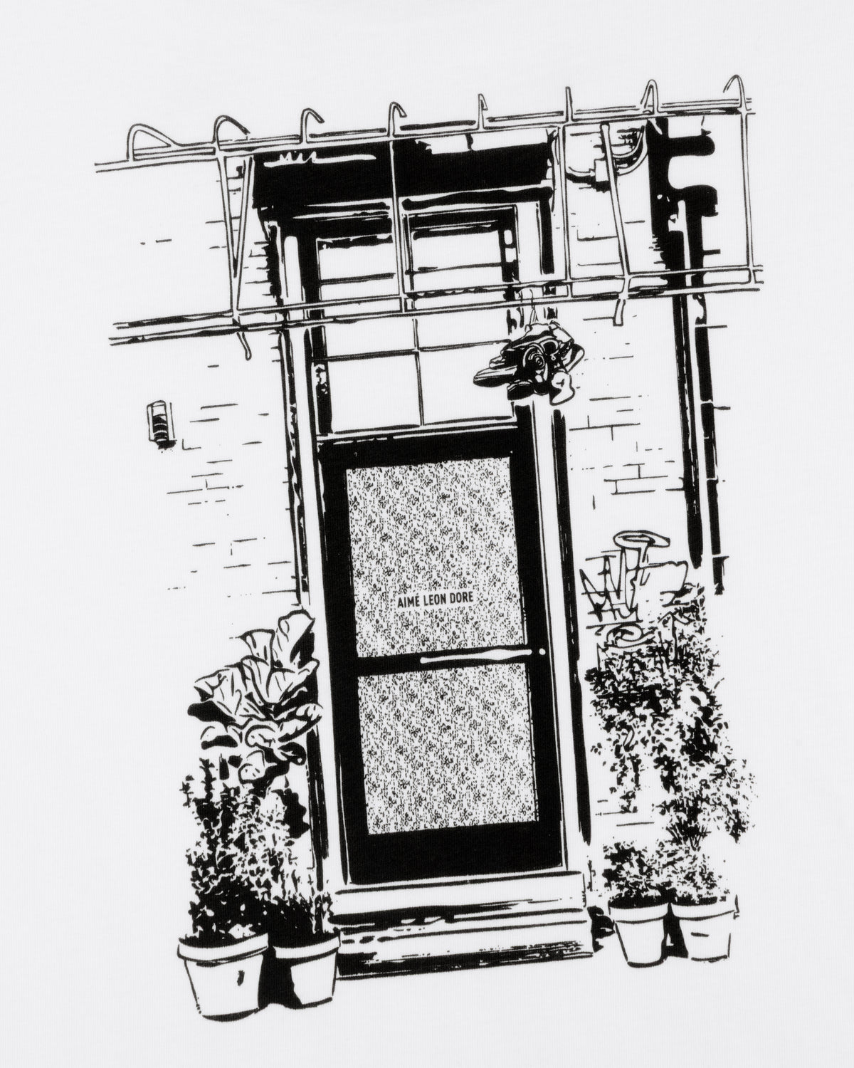 Black and white drawing of a door with potted plants, a fire escape, and "Mott Street Tee" sign above.