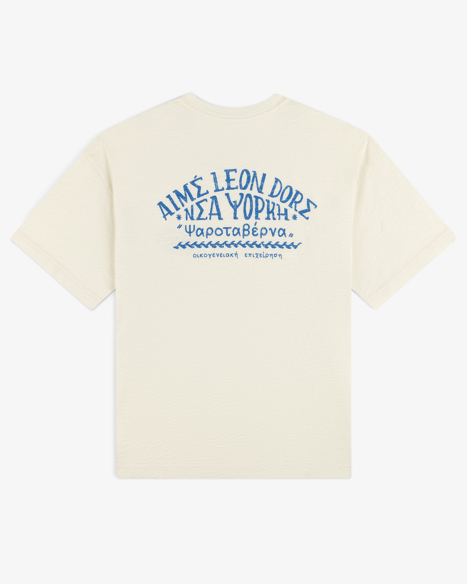 Off-white Taverna Tee with blue Greek text and "AIMÉ LEON DORE" in stylized letters on the back.
