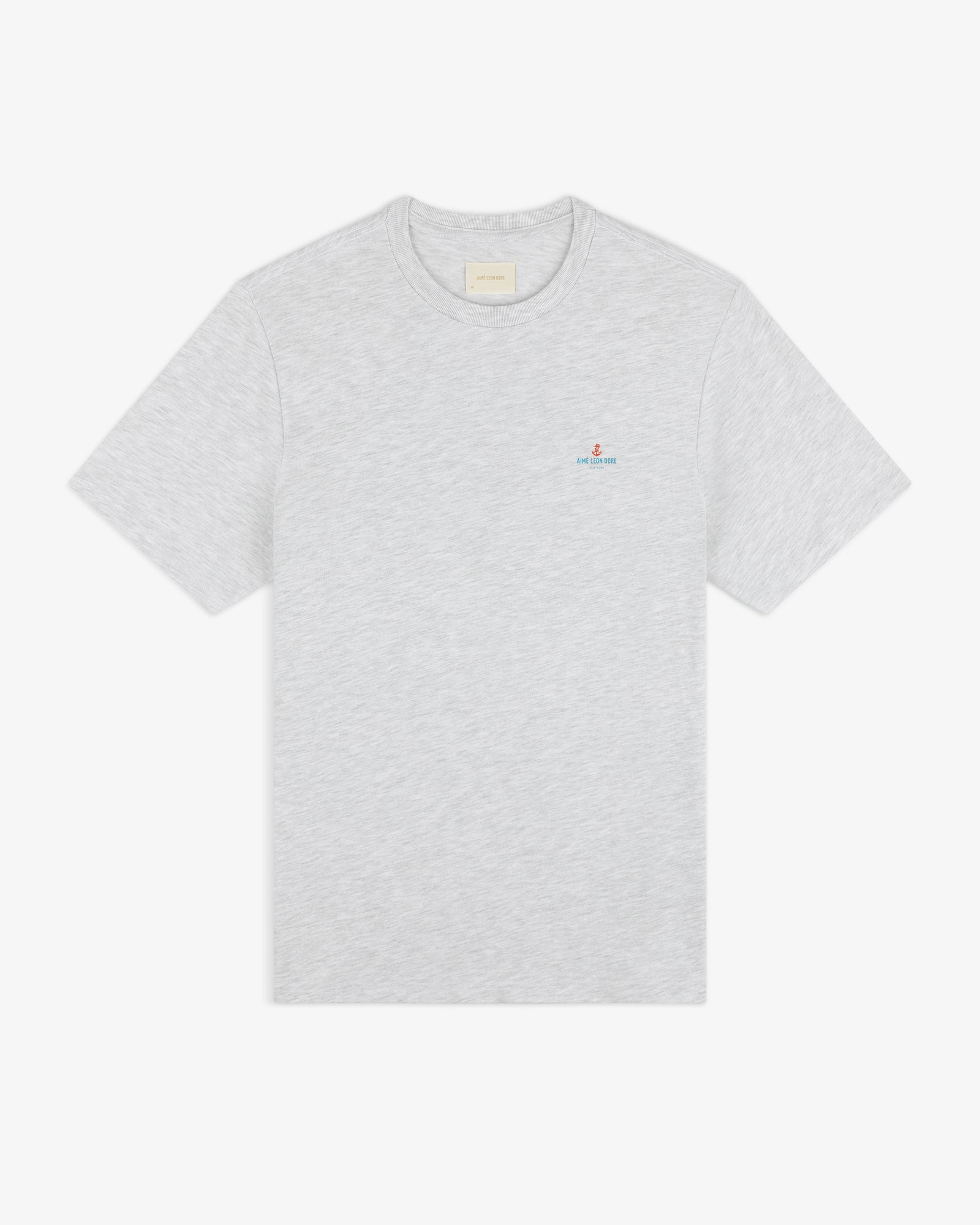 Coastal Flag Tee: light gray short-sleeve t-shirt with small embroidered logo on left chest, shown on white background.