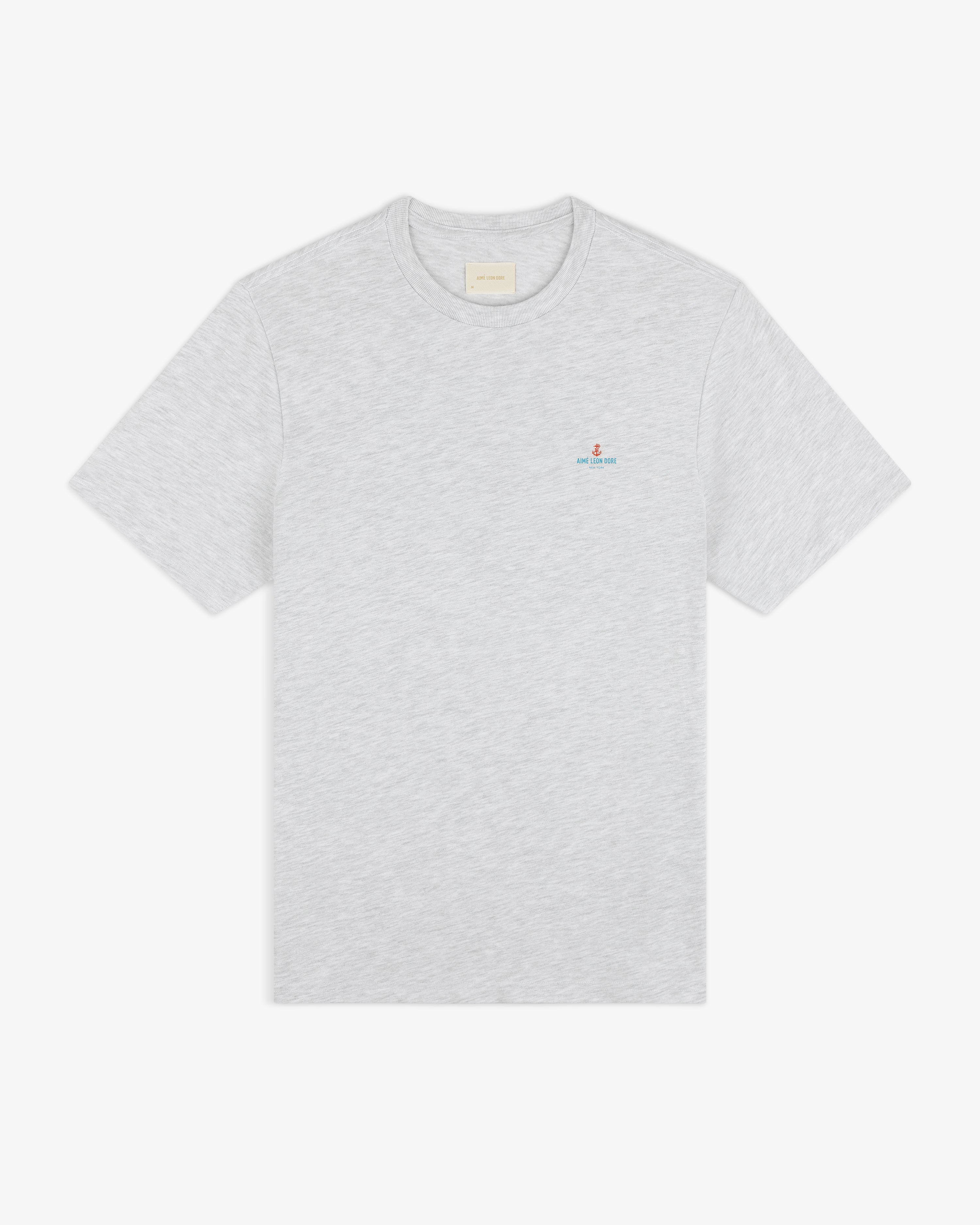 Coastal Flag Tee: light gray short-sleeve t-shirt with small embroidered logo on left chest, shown on white background.