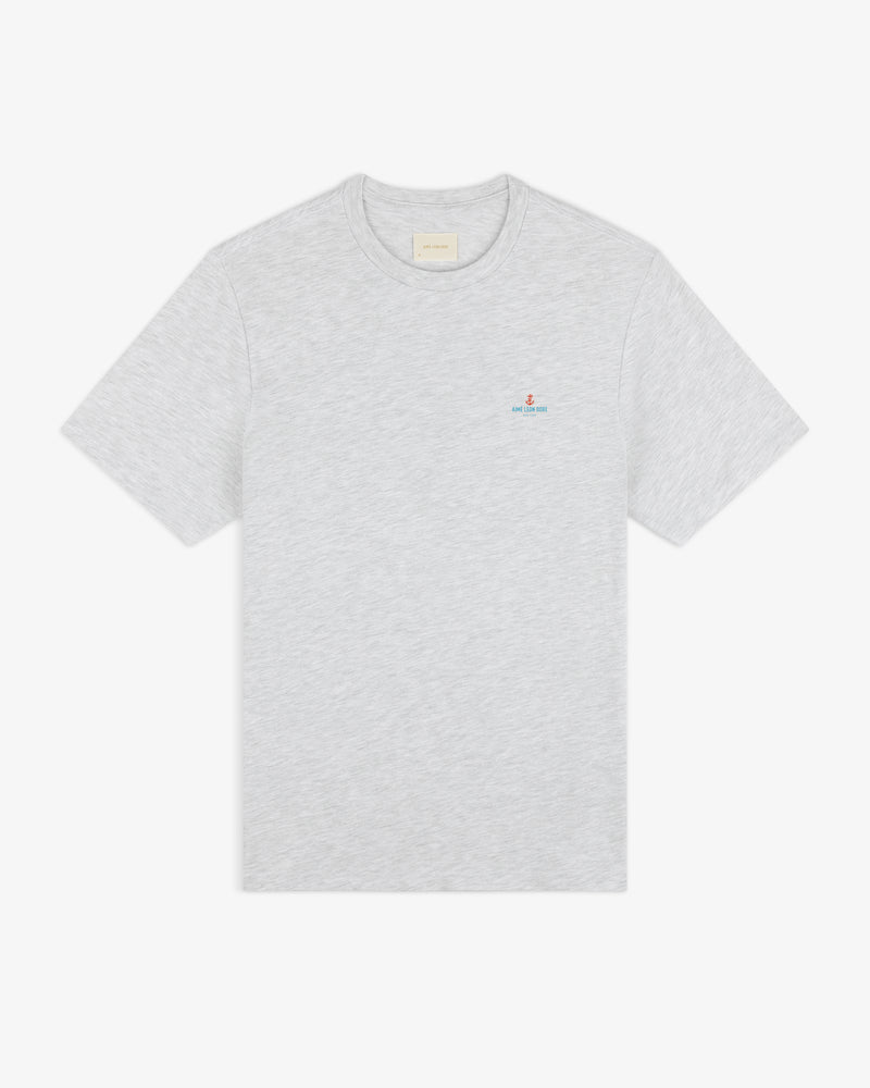 Coastal Flag Tee: light gray short-sleeve t-shirt with small embroidered logo on left chest, shown on white background.