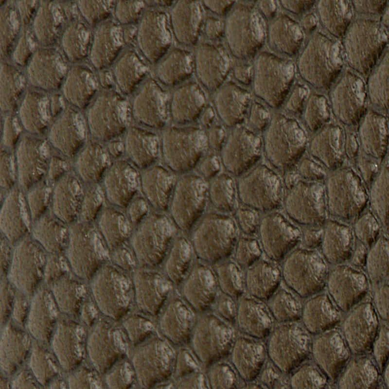 Close-up of brown Leather Lug Sole Derby with a pebbled, reptile-like textured surface.