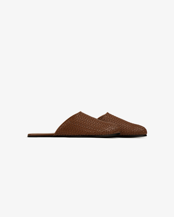Leather Raffia Mule shown in side view with flat soles on a plain white background.