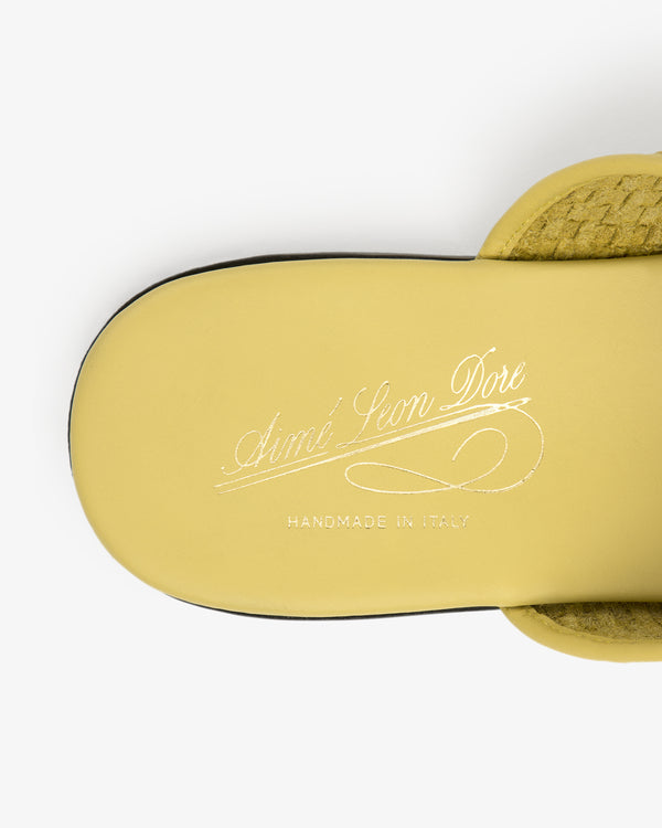 Leather Raffia Mule in yellow with "Aimé Leon Dore Handmade in Italy" in white cursive on the insole, top view.