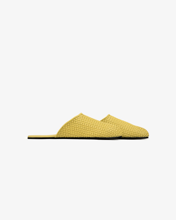 Leather Raffia Mule in yellow, closed toe and open heel, shown side view on a plain white background.