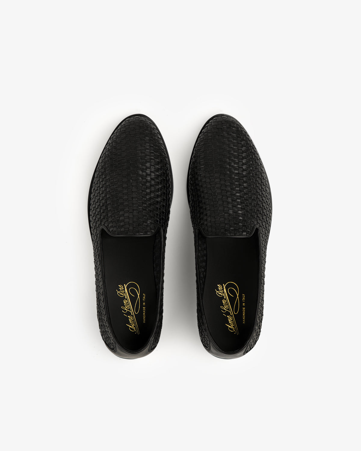 Black Leather Raffia Loafer slip-ons viewed from above on a white background.