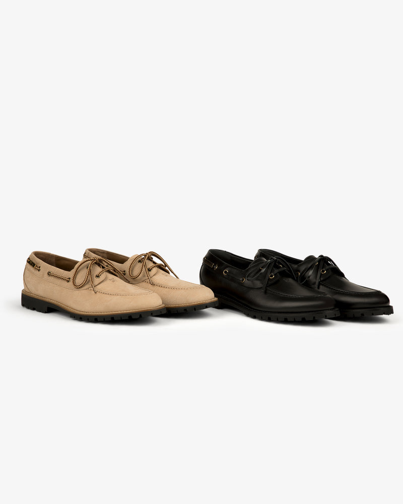 Pápia Boat Shoe in tan and black leather with laces, shown side by side on a plain white background.