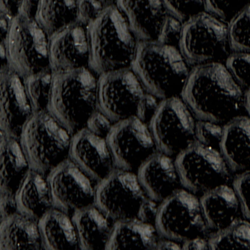 Close-up of black, textured Leather Lug Sole Derby with a scale-like pattern resembling alligator skin.