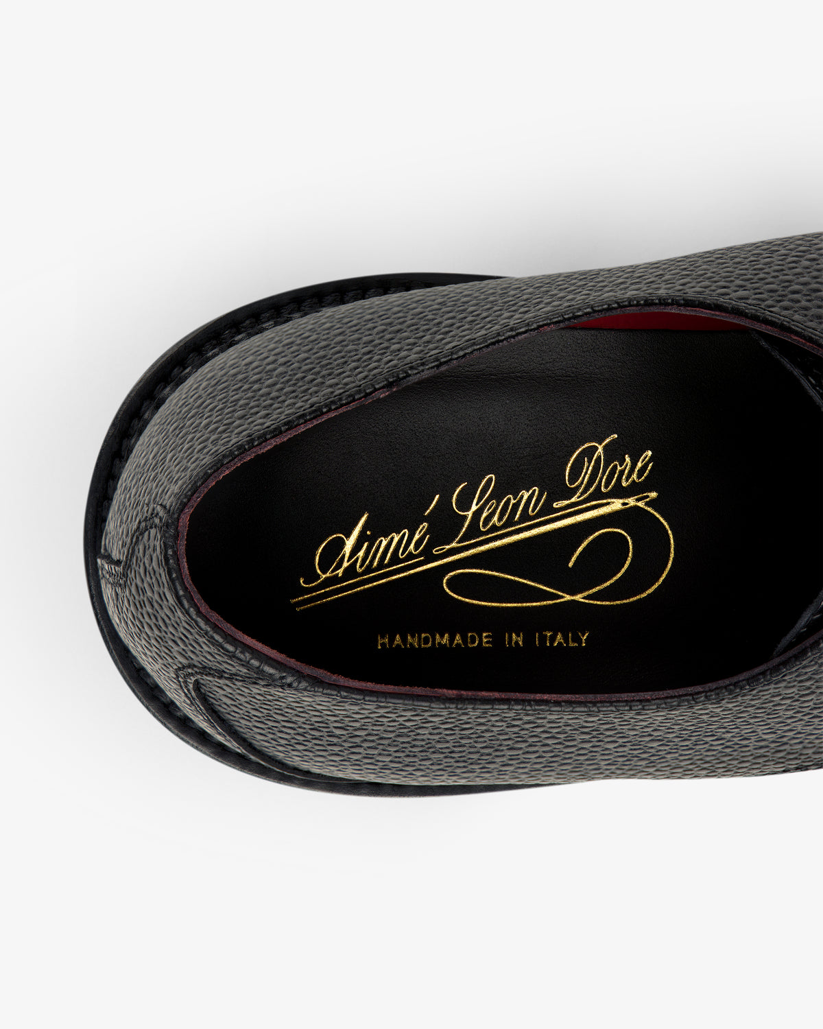 Top view of a gray Leather Lug Sole Derby with Aimé Leon Dore HANDMADE IN ITALY in gold on the insole.