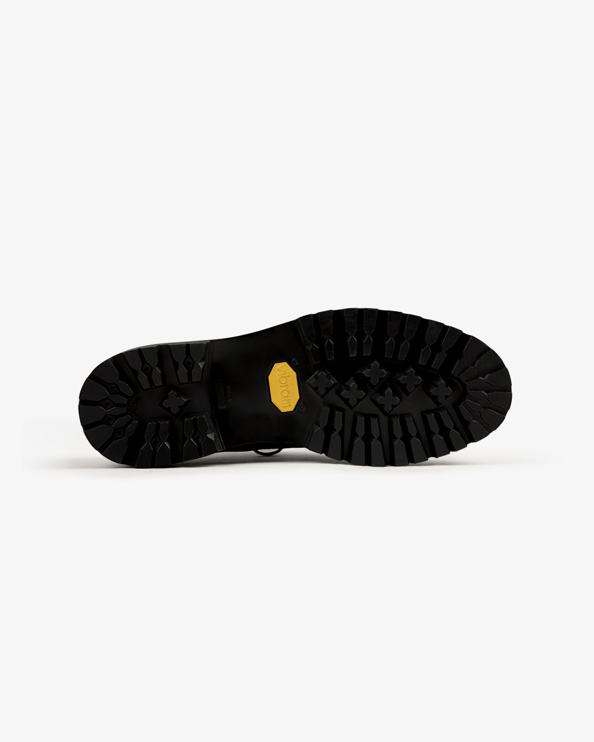 Leather Lug Sole Derby featuring a black sole with deep tread and yellow Vibram logo, set on a white background.