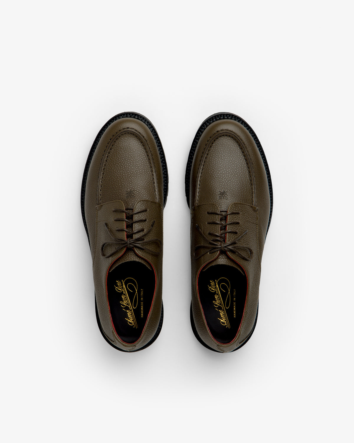 Leather Lug Sole Derby shoes in olive green lace-up style featuring textured leather and thick black lug soles.