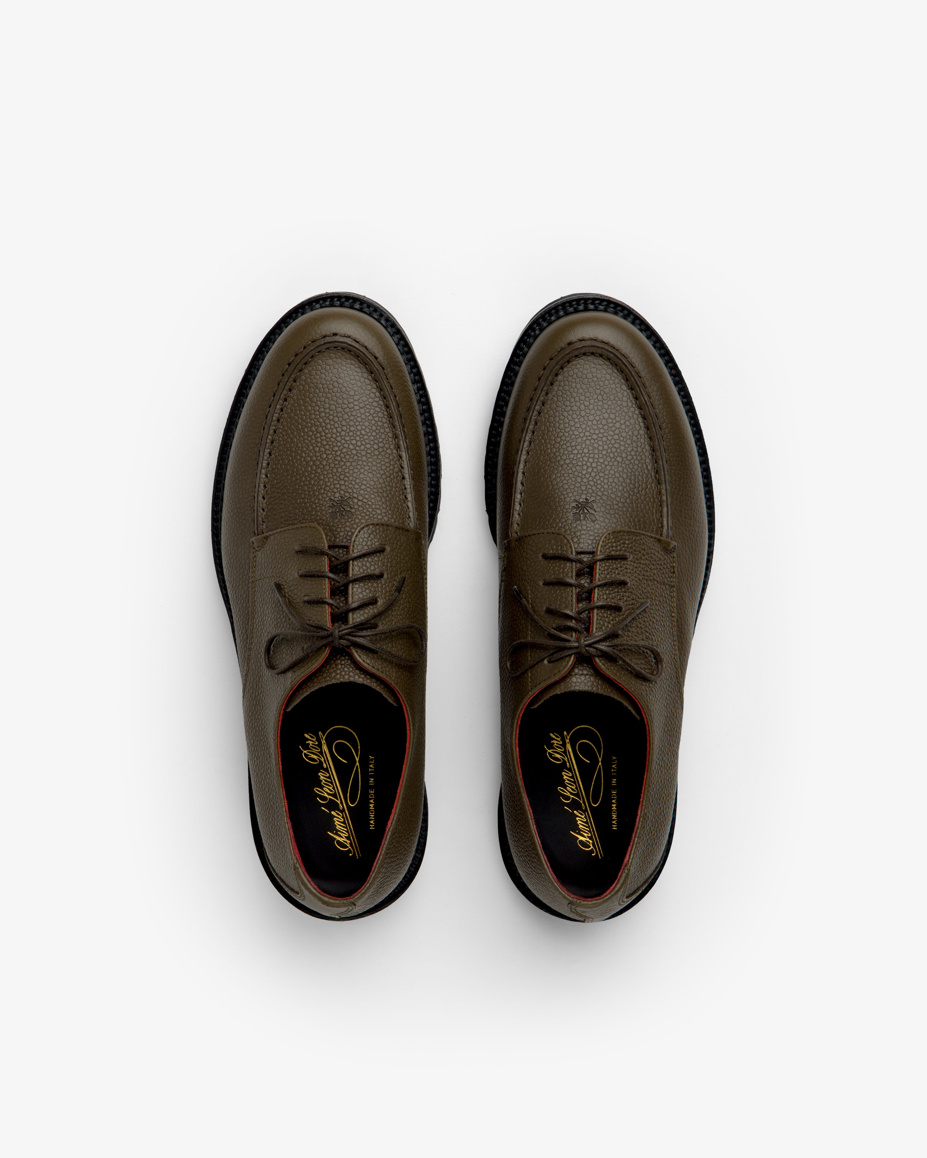 Leather Lug Sole Derby shoes in olive green lace-up style featuring textured leather and thick black lug soles.