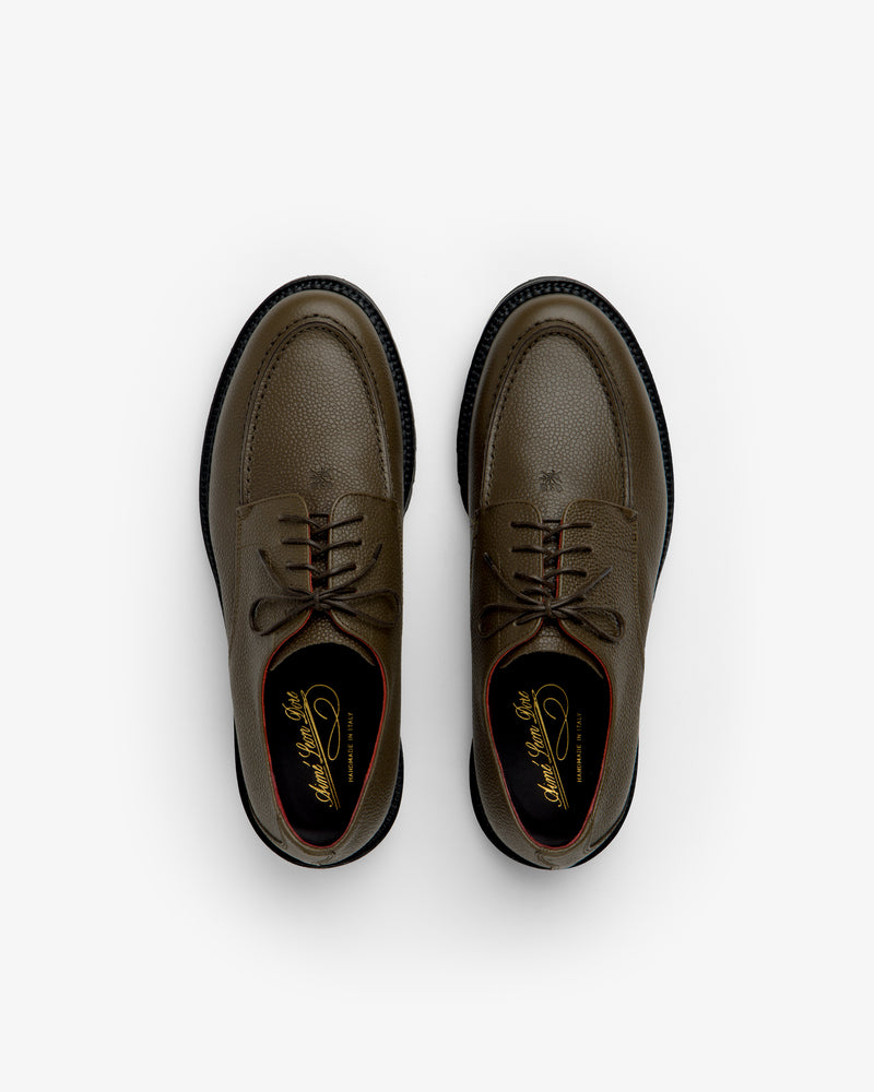 Leather Lug Sole Derby shoes in olive green lace-up style featuring textured leather and thick black lug soles.