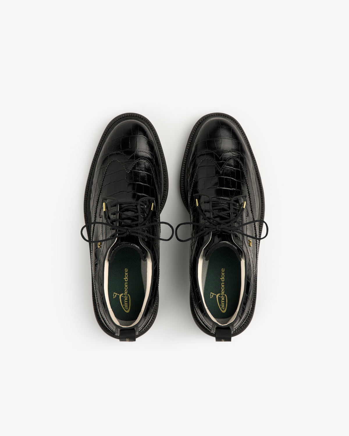 ALD / Footjoy Croc-Embossed Premiere Series Marquis black leather dress shoes, top view on white background.