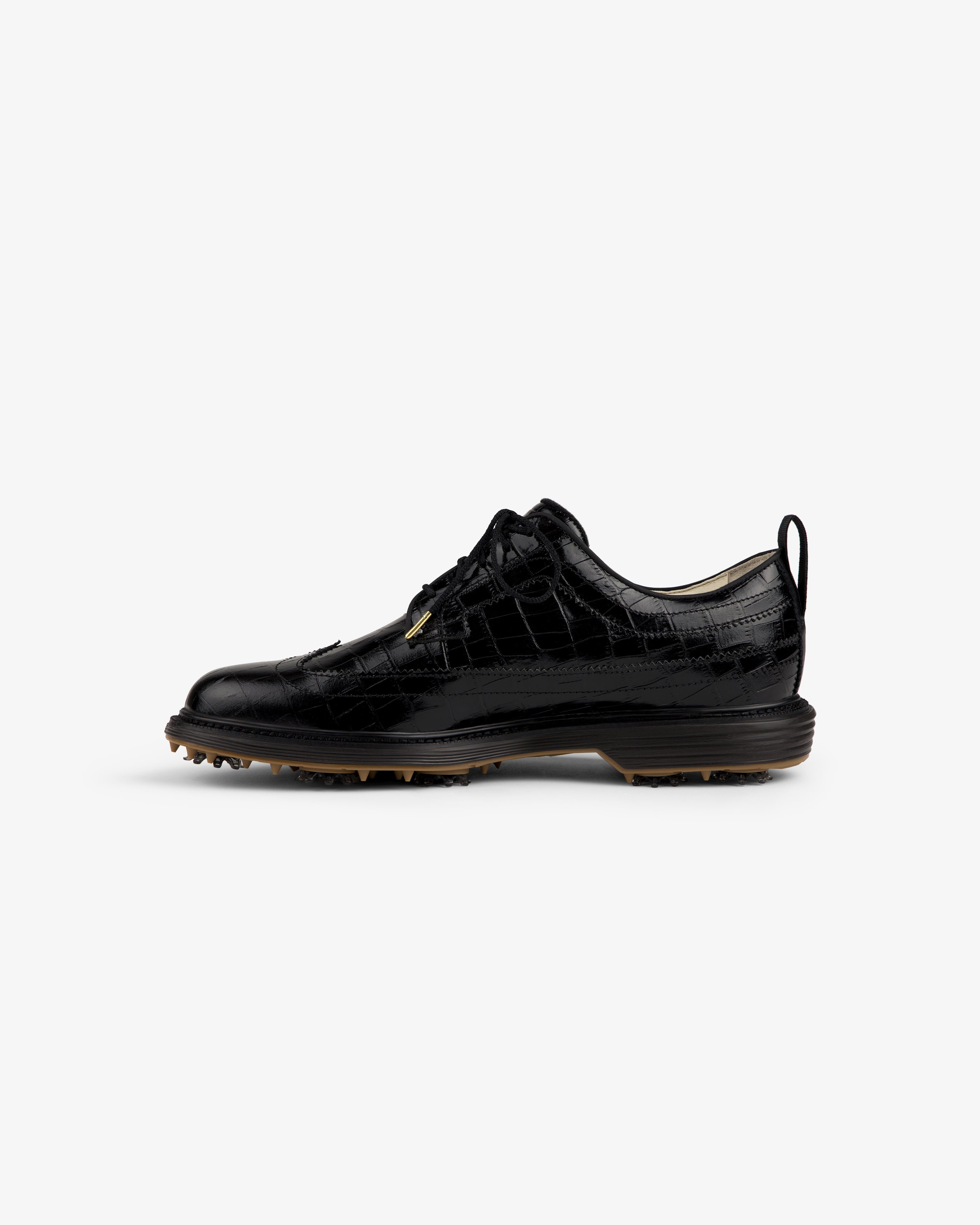 ALD / Footjoy Croc-Embossed Premiere Series Marquis: black leather golf shoe with spiked sole, side view.