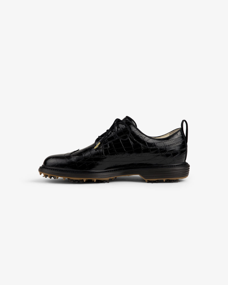 ALD / Footjoy Croc-Embossed Premiere Series Marquis: black leather golf shoe with spiked sole, side view.