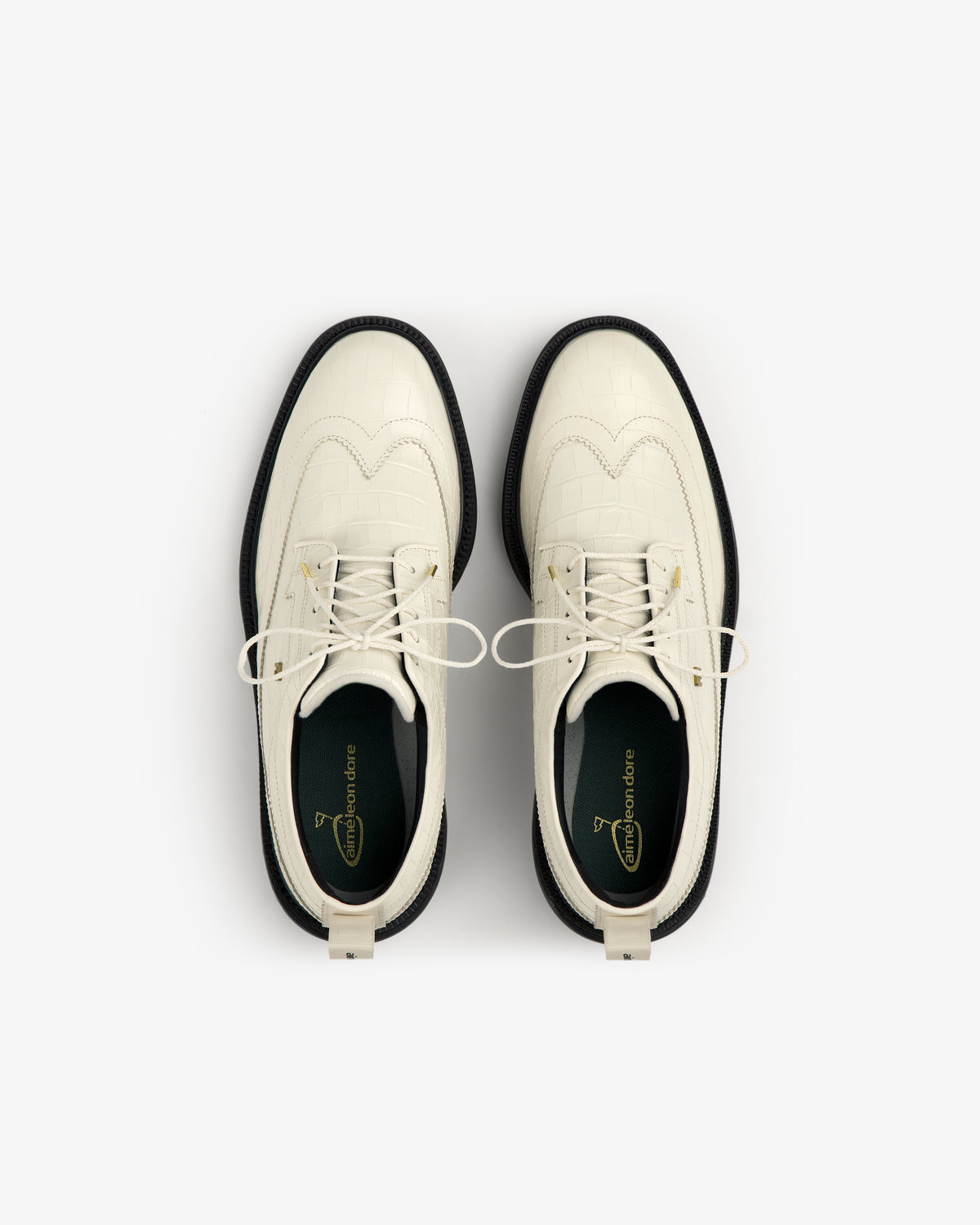 ALD / Footjoy Croc-Embossed Premiere Series Marquis white lace-up dress shoes with black soles, top view.