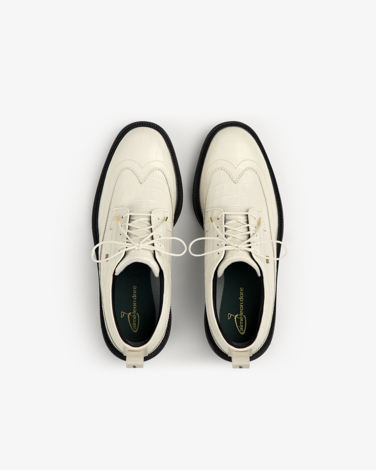 ALD / Footjoy Croc-Embossed Premiere Series Marquis white lace-up dress shoes with black soles, top view.