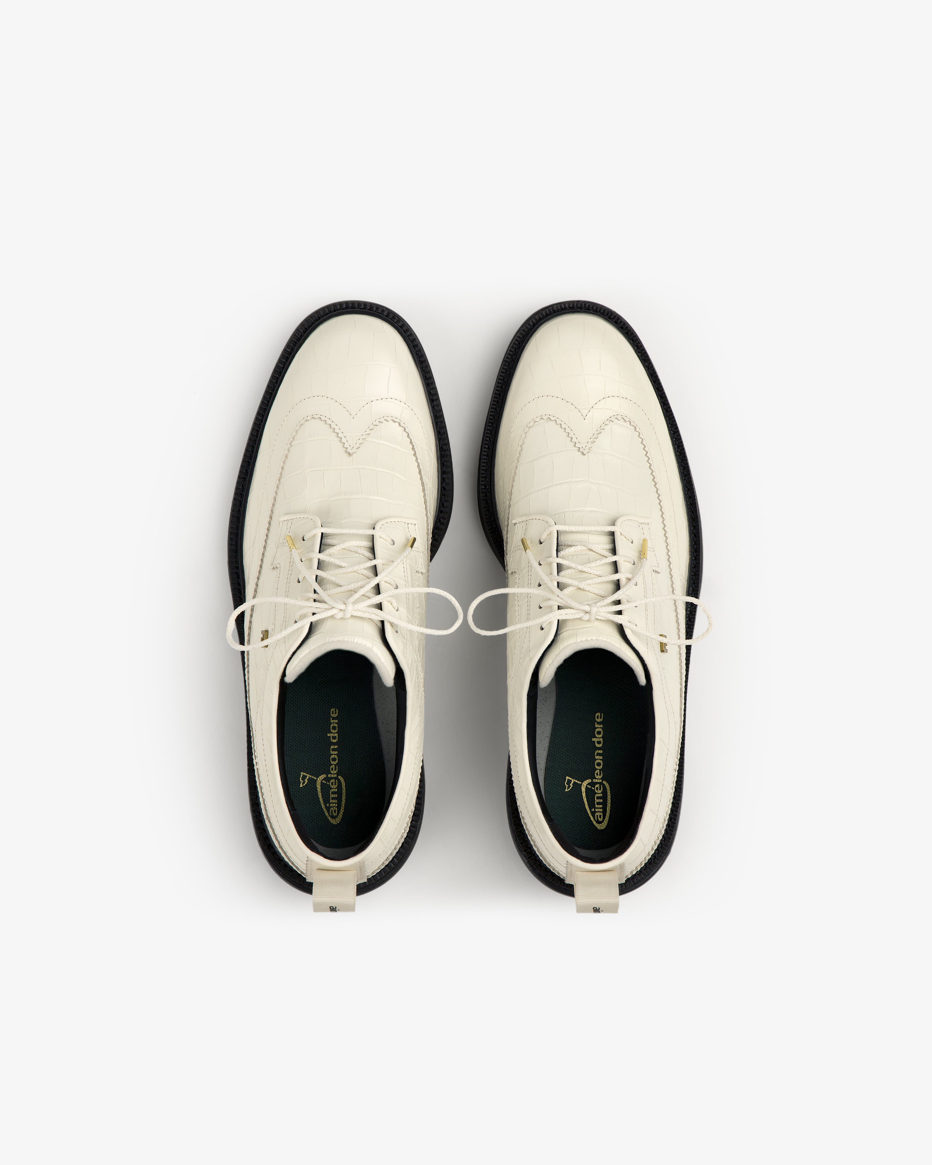 ALD / Footjoy Croc-Embossed Premiere Series Marquis white lace-up dress shoes with black soles, top view.