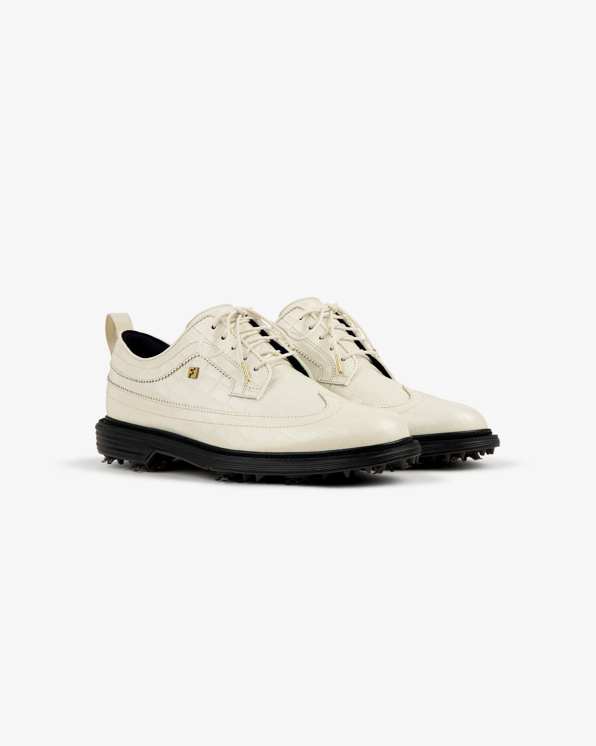 ALD/Footjoy Croc-Embossed Premiere Series Marquis ivory lace-up golf shoes with black soles on white background.