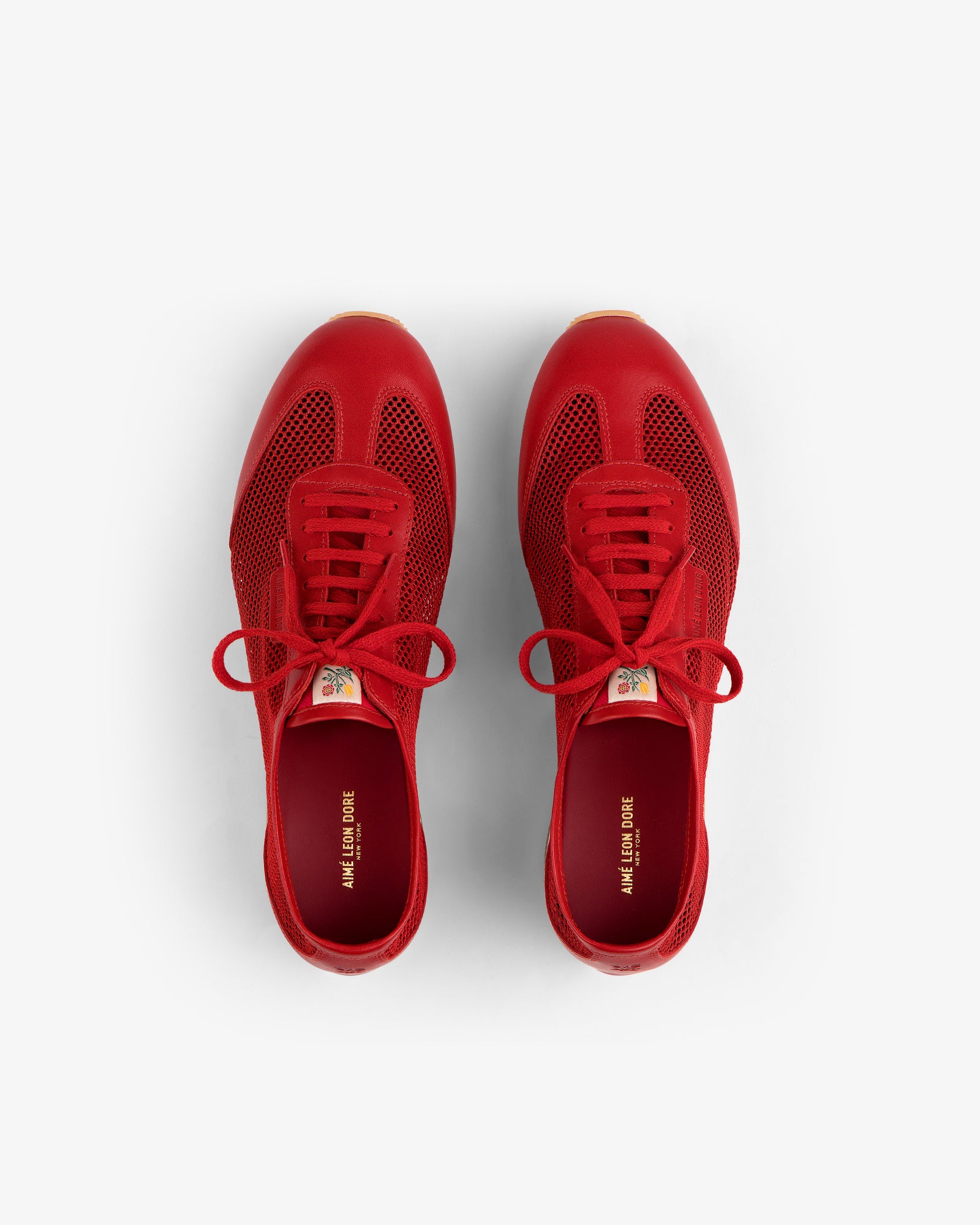 Low Profile Mesh Trainer sneakers in red with laces, top view on a white background.